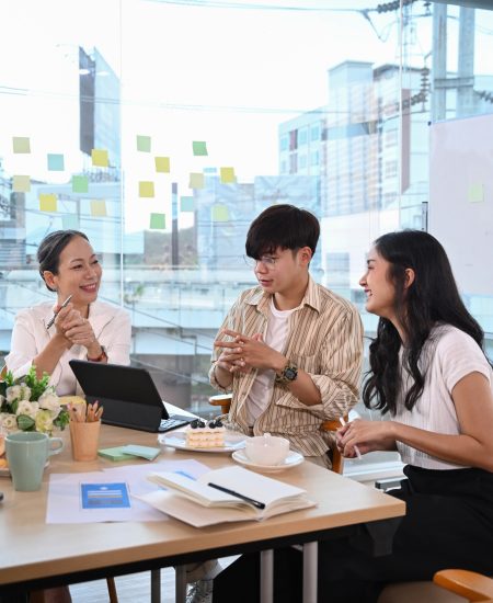Mature businesswoman negotiating growth business plan with diverse executive managers. Mature businesswoman negotiating growth business plan with diverse executive managers.